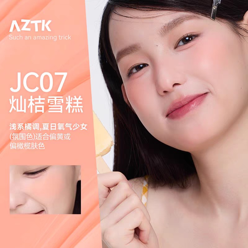 Woman with a close-up of her face, featuring makeup product JC07, with AZTK branding on an orange background.