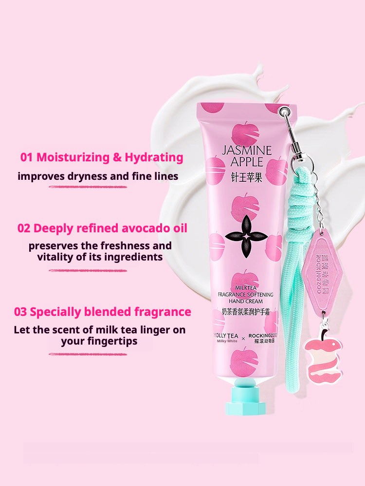 Mollytea Rockingzoo Hand Cream tube with jasmine-apple pattern, teal tassel charm, on pink background.