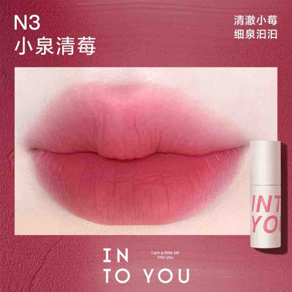 INTO YOU Airy Lip &amp; Cheek Mud in W9, displaying a vibrant soft sweet pink shade for a fresh and youthful appearance