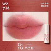 INTO YOU Airy Lip & Cheek Mud in W2, offering a warm, apricot shade for a sweet and youthful look