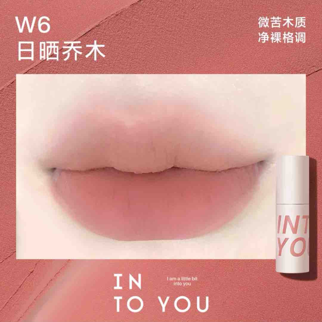 INTO YOU Airy Lip &amp; Cheek Mud in W6, showcasing a soft, natural beige-pink shade perfect for a subtle everyday look