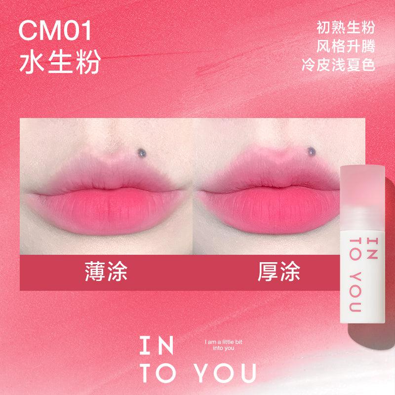 INTO YOU Cloudy Lip Mud in CM01, showcasing a soft pink shade that offers a delicate and fresh look, perfect for a natural finish