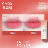 INTO YOU Cloudy Lip Mud in CM03, offering a warm peachy shade that enhances the lips with a soft and romantic feel