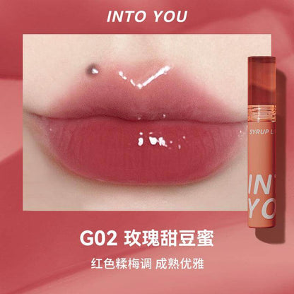 Experience the INTO YOU Syrup Glossy Lip Tint—long-lasting, multidimensional lip gloss with vibrant colors and moisturizing texture. Non-sticky, lightweight formula perfect for all-day lip protection, especially in dry weather.