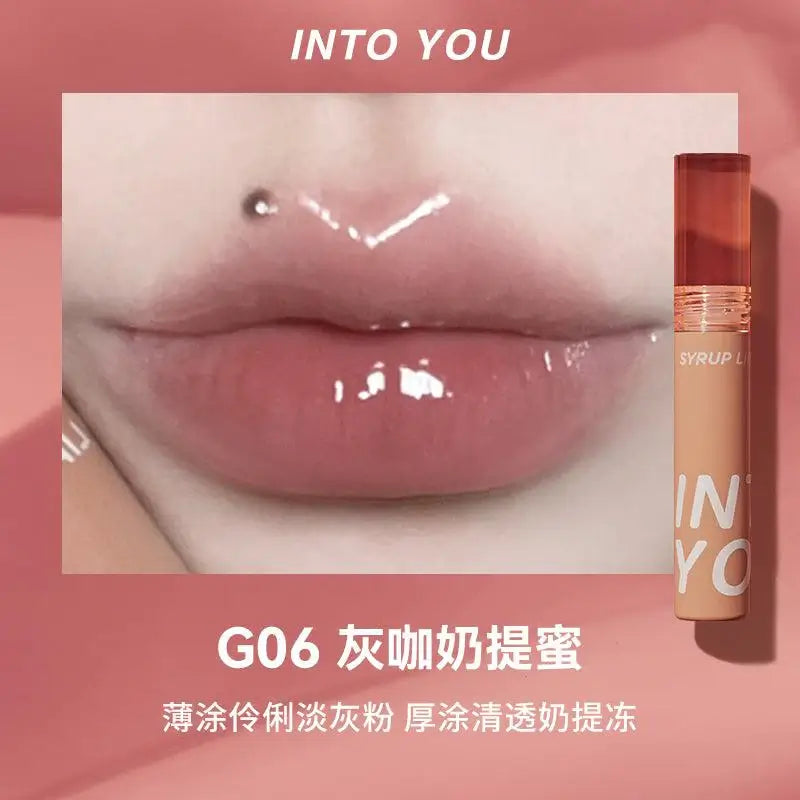 Experience the INTO YOU Syrup Glossy Lip Tint—long-lasting, multidimensional lip gloss with vibrant colors and moisturizing texture. Non-sticky, lightweight formula perfect for all-day lip protection, especially in dry weather.