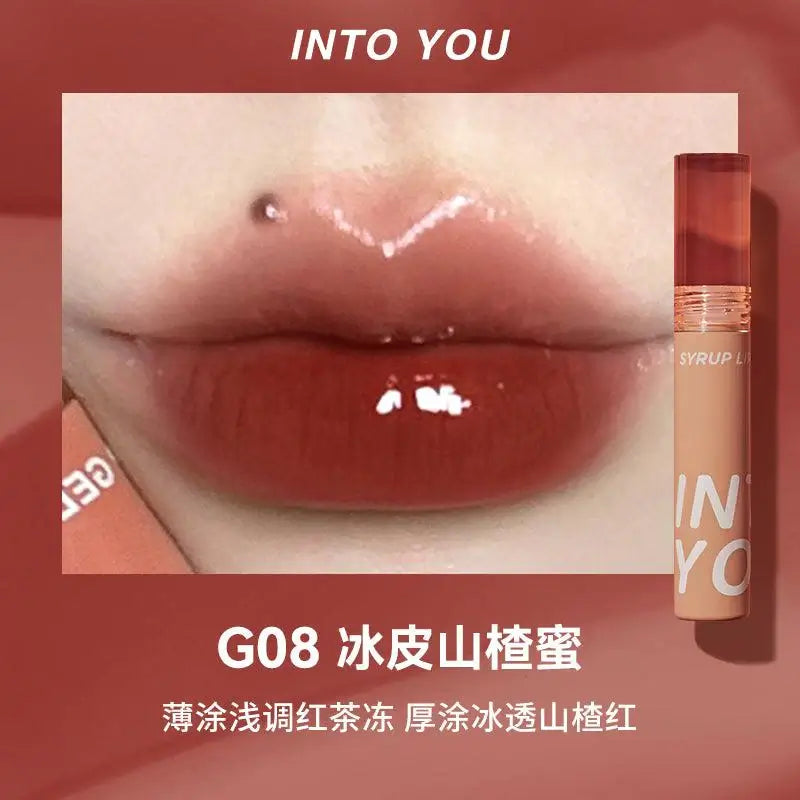 Experience the INTO YOU Syrup Glossy Lip Tint—long-lasting, multidimensional lip gloss with vibrant colors and moisturizing texture. Non-sticky, lightweight formula perfect for all-day lip protection, especially in dry weather.