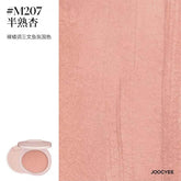 Detailed texture of JOOCYEE New Loose Powder Matte Blusher in shade M207, a nude orange tone that adds warmth and dimension to the complexion with a seamless matte finish