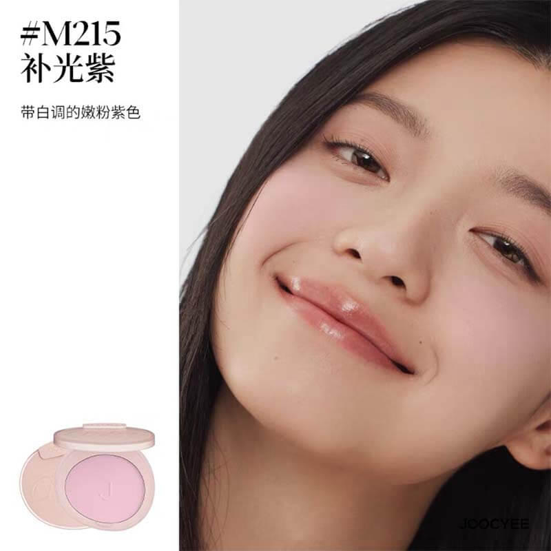 Model smiling with JOOCYEE New Loose Powder Matte Blusher in shade M215, a lively pink-purple shade that brightens the cheeks with a soft, matte finish